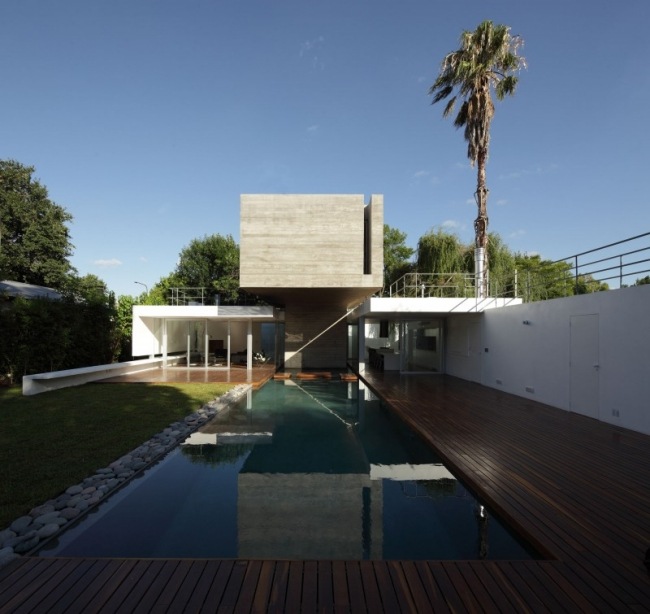 Betonghus vatten pool platt tak konstruktion modern arkitektur bunker hus