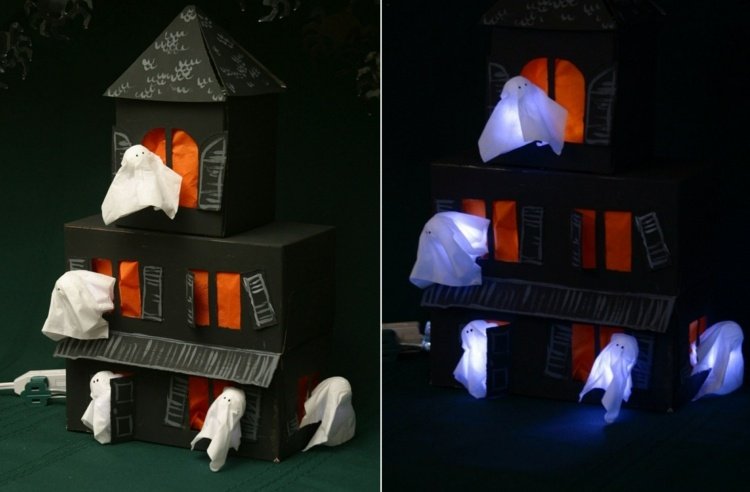 Lykta som en Halloween -hantverksidé - hemsökt hus av en mjukpapperslåda med spöken
