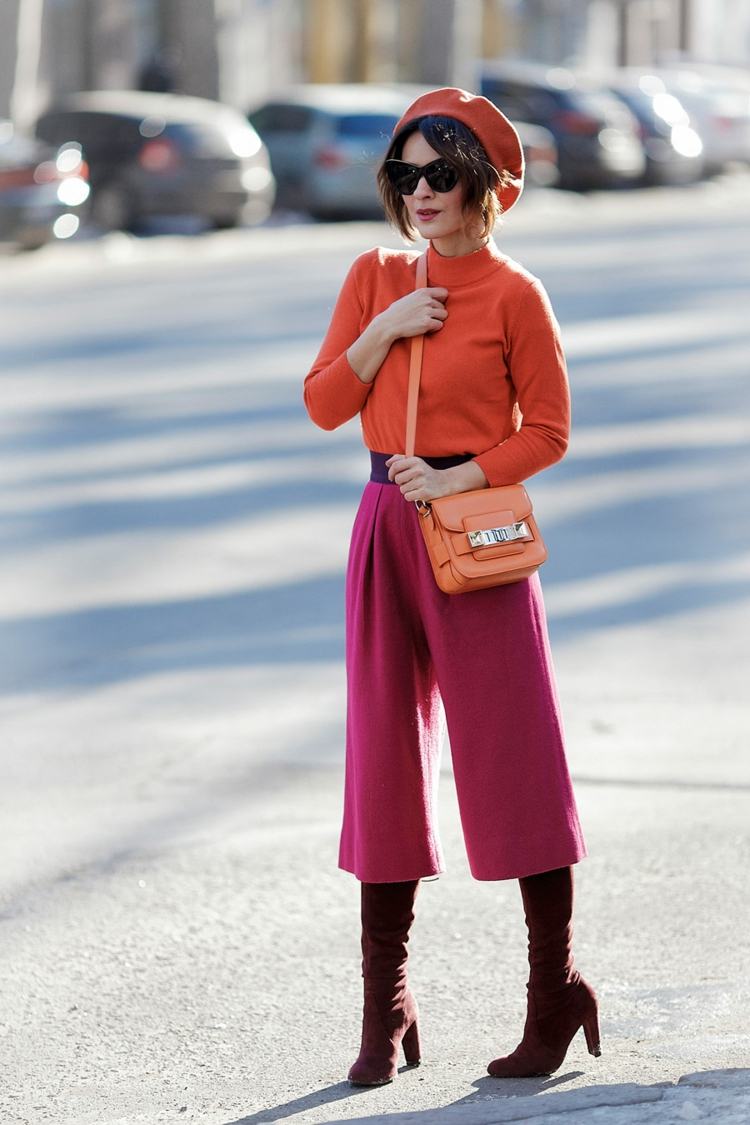 Culottes kombinerar orange tröja damhattstövlar höga klackar handväska modetrender