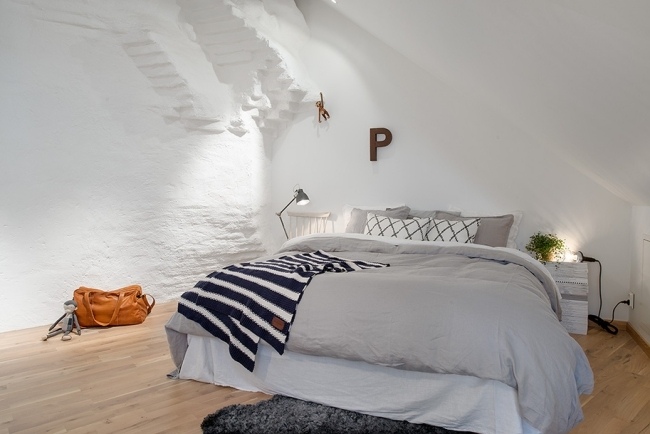 sovrum minimalistisk grå vit vägg gips trägolv