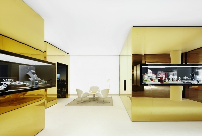 Design av smycken butik ohlab arkitekter gyllene plattor i rostfritt stål