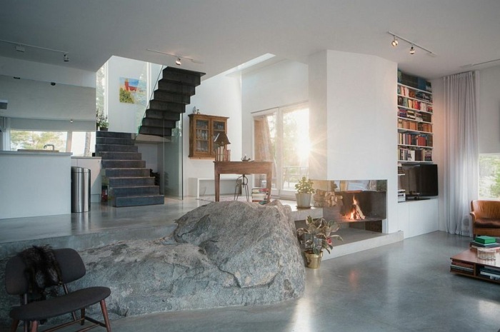 modern design vardagsrum öppen spis komfort sten natur accent hus