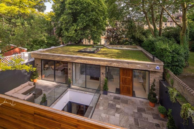 trädgård-staket-integritet-modernt-hus-modern-arkitektur-natursten-utomhus