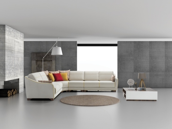 Boyta nästan minimalistisk soffbord sittgrupp grå betongvägg rund matta