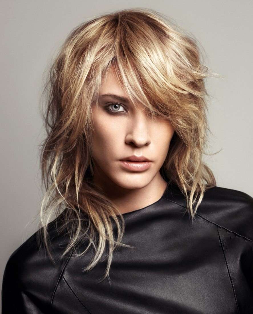 Layered cut long hair volume on the top of the head disheveled hair