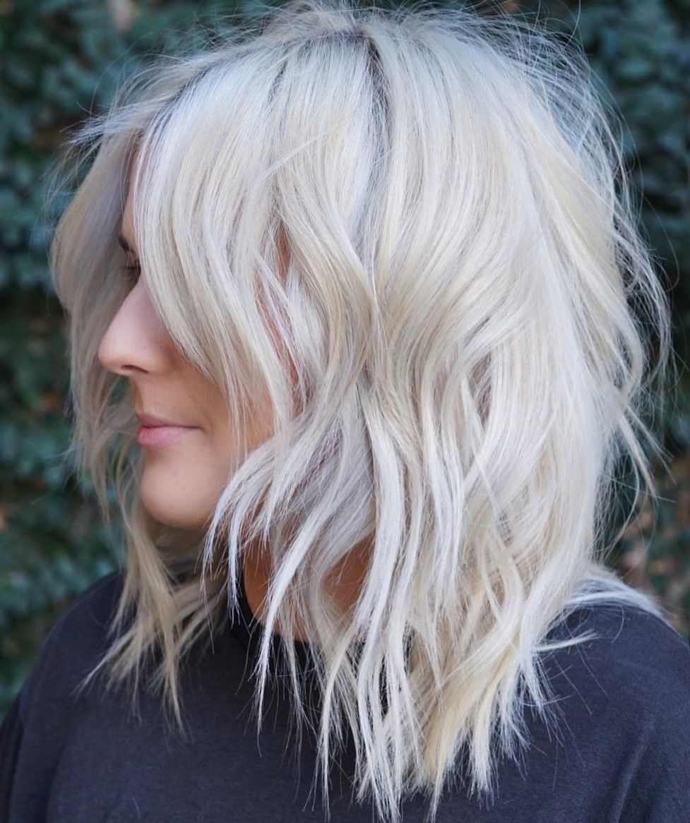 tiered bob fringed platinum blonde with curtain bangs center parting