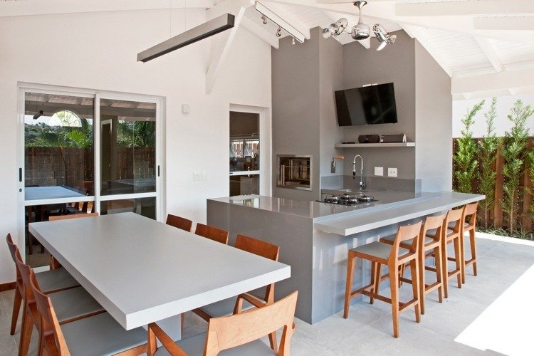 modernt kök nyanser av grått vatten kran vägg TV bar matbord