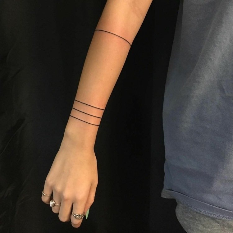 minimalistiskt tatuering armband kvinna linjer handled underarm