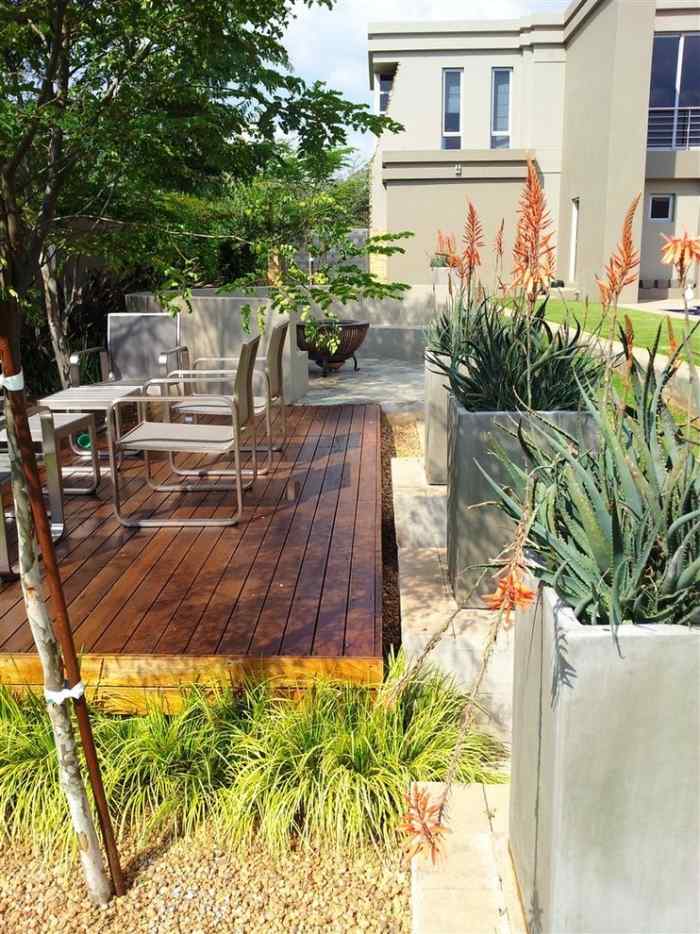 idéer-DIY-sekretess-skydd-för-terrass-betong-planter-exotiska-växter