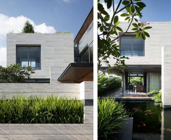hus design gjord av travertin sten gröna områden