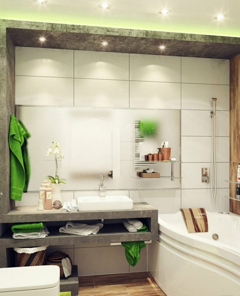 badrum litet betongutseende vita kakel gröna detaljer deco