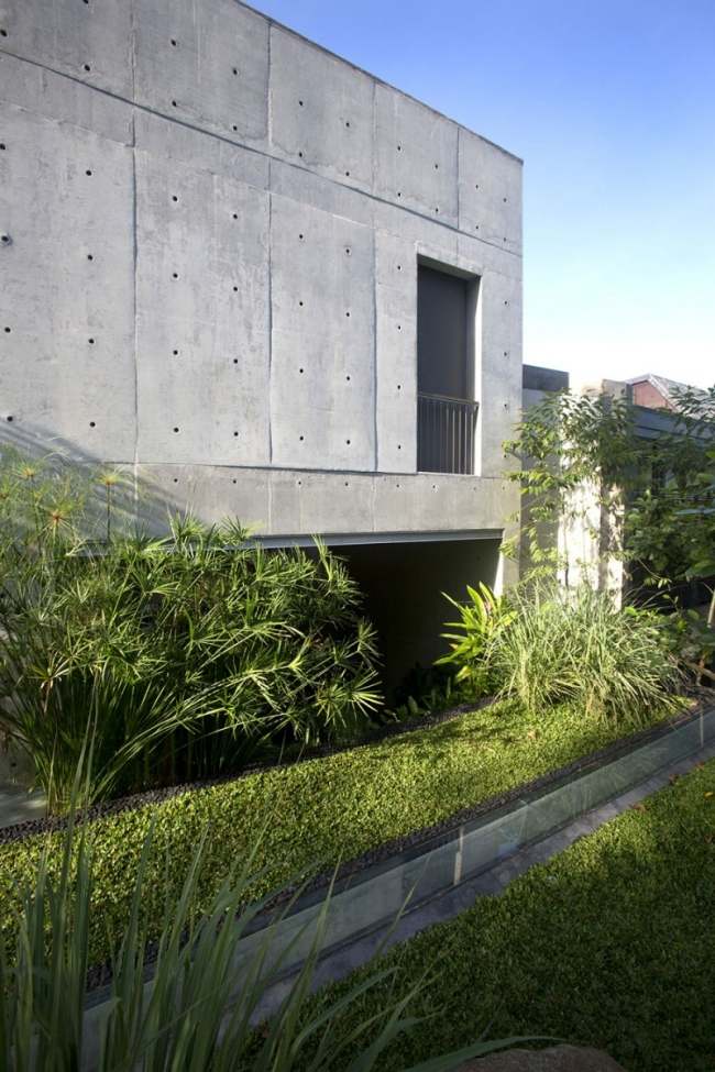 modernt flerfamiljshus armerad betong fasad chang arkitekter landskapsarkitektur