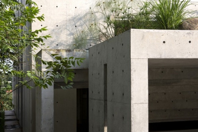 moderna flerfamiljshus betongfasader terrasser landskapsarkitektur