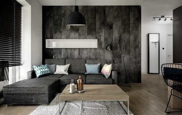 Modernt vardagsrum soffa-antracit-trä-soffbord-kvadrat-färgglada-kuddar-trägolv