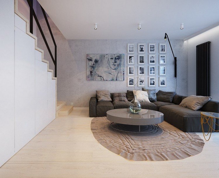 Modernt vardagsrum hörnsoffa-grå-rund-soffbord-högglans-ljust trägolv