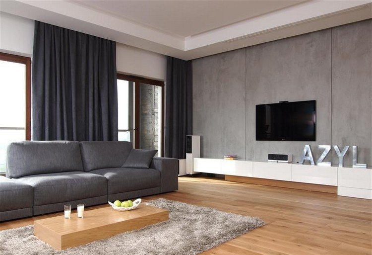 modernt-vardagsrum-soffa-grått-trä-golv-shaggy-matta-vit-low-board-tv-vägg