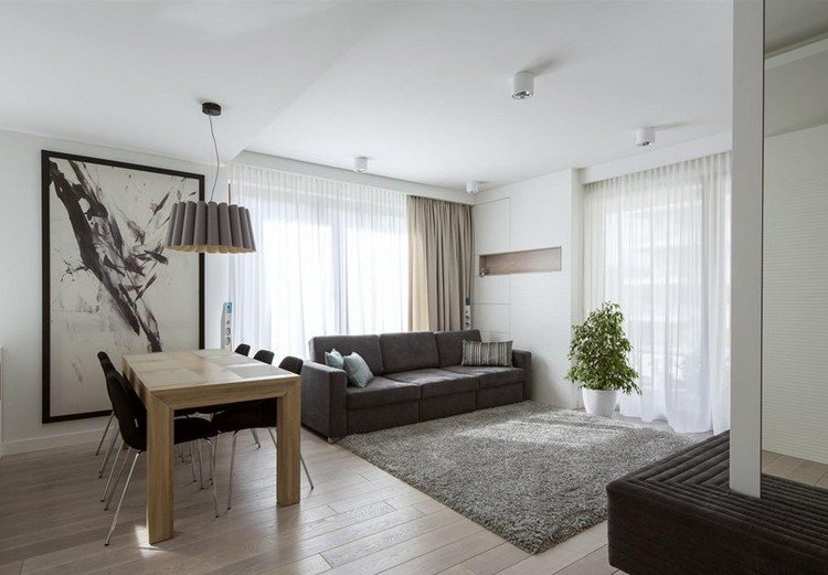modernt-vardagsrum-soffa-3-sits-grå-shaggy-matta-trä-golv-matbord