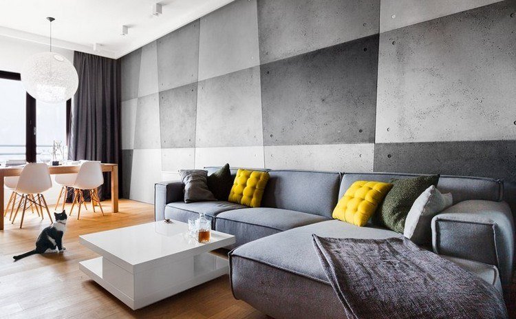 modernt vardagsrum-soffa-grå-gul-kuddar-vitt-soffbord högglans