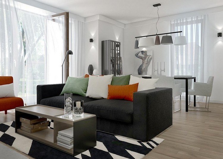 modernt vardagsrum-soffa-2-sits-trä-golv-orange-gröna-kuddar