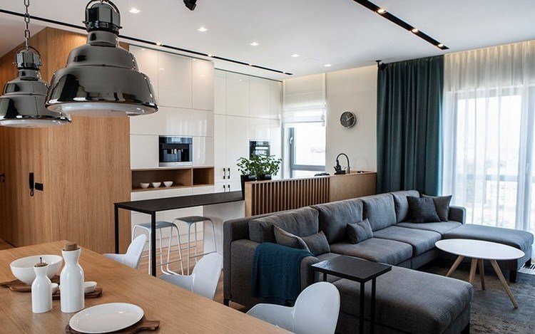 modernt vardagsrum-hörn-soffa-vitt-kök-trä-matbord