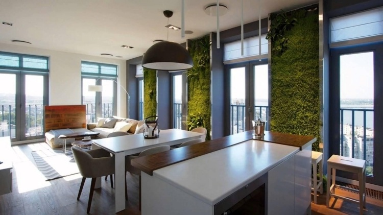 vertikal-trädgård-öppen-planering-vardagsrum-matsal-bord-stolar-soffa-loft-fönster-dörrar