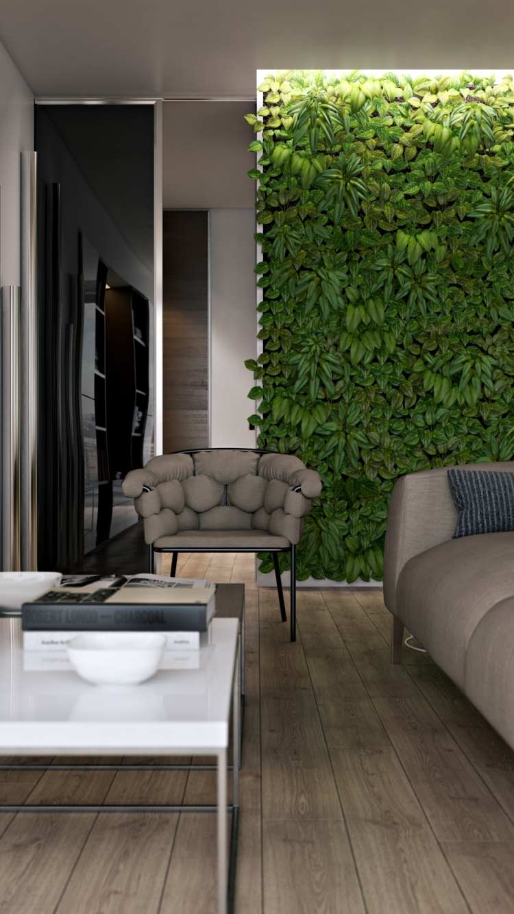 vertikal-trädgård-vardagsrum-golv-trä look-soffa-soffbord-belysning-växter-grå-fåtölj