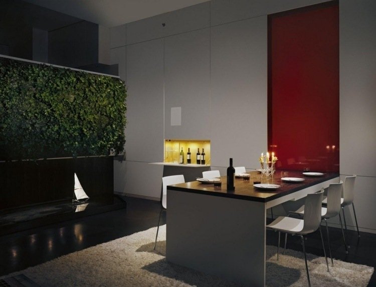 vertikal-trädgård-matsal-modern-matsal-bord-stolar-svart-vit-röd-matta-mjukt inbyggda skåp-dold-subtil-belysning