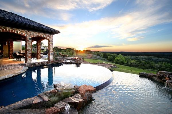 öppen spis pool dekoration stenar täckt terrass solnedgång