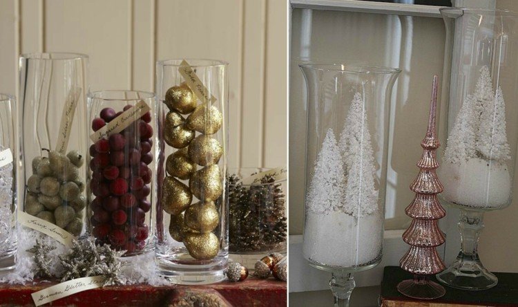 Juldekorera stora glasvasar fruktpäron guldglitterfrukter vinterlandskap granar
