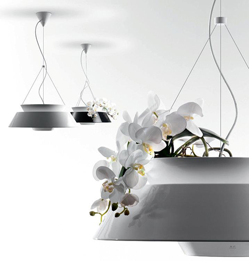 unik lampdesign kombinerar lampa och blomkruka orkidé