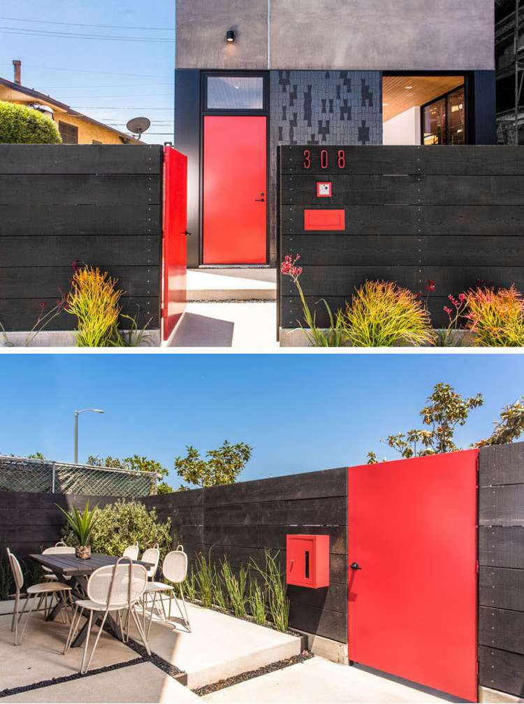 Fasad i grått staket-svart-hus-dörr-trädgårdsdörr-rött