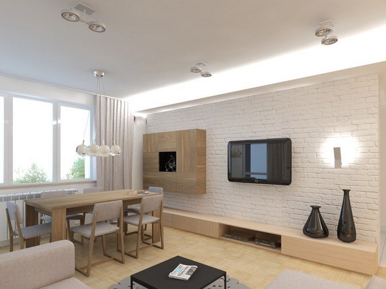 TV-väggmonterad-vardagsrum-vit-tegel-vägg-lowboard-ljus-trä