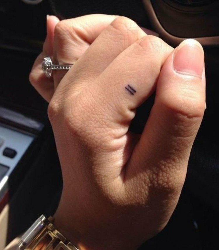 finger-tattoo-index-finger-stroke-sideways-equals-woman-hand-ring-watch