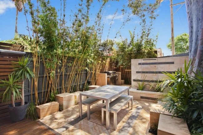 Tropisk trädgård terrakottakakel möbler utomhus bostadshus Sydney Rolf-Ockert-Design