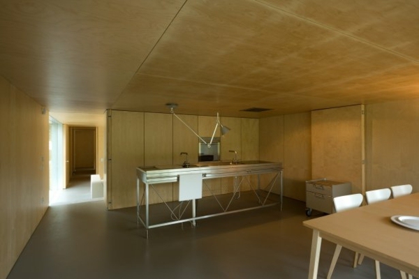 minimalistisk-waldhaus-betong-look-vägg-design-kök-rostfritt stål