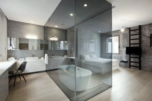 sovrum badrum inredning exponerade betong badkar glas låda