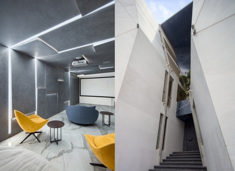 Atriumhusets fasad klädd i natursten och rum med marmorgolv med grå väggar och LED -belysning