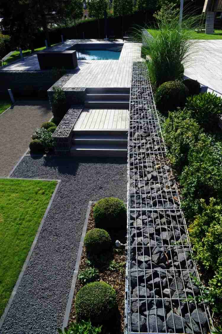 gabion vägg-gabion staket-modern-trädgård-design-häck-grönska-växter-boxwood