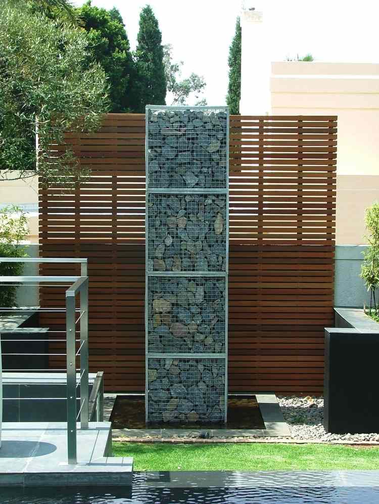 Gabion vägg-gabion staket-modern-trädgård-design-trä-sekretess-skydd-design-damm-dekoration