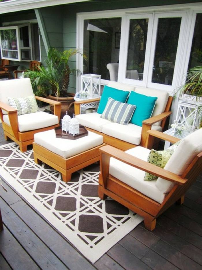 exotisk trädgård design terrass matta palmer kruka soffa