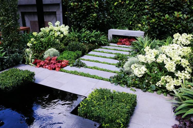 trädgårdsarbete och landskapsarkitektur trädgårdsväg-idé-blommor-grönska-bänk-betong