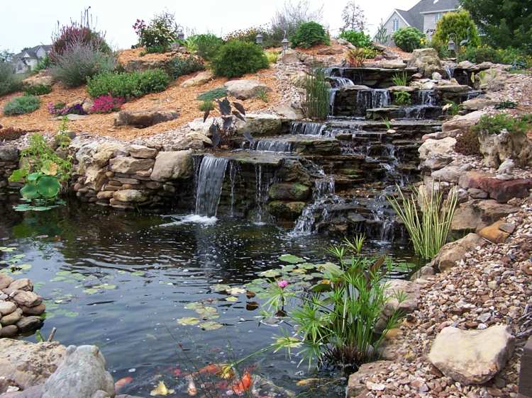 trädgård design damm byggnad vattenfall stenplattor exotiska