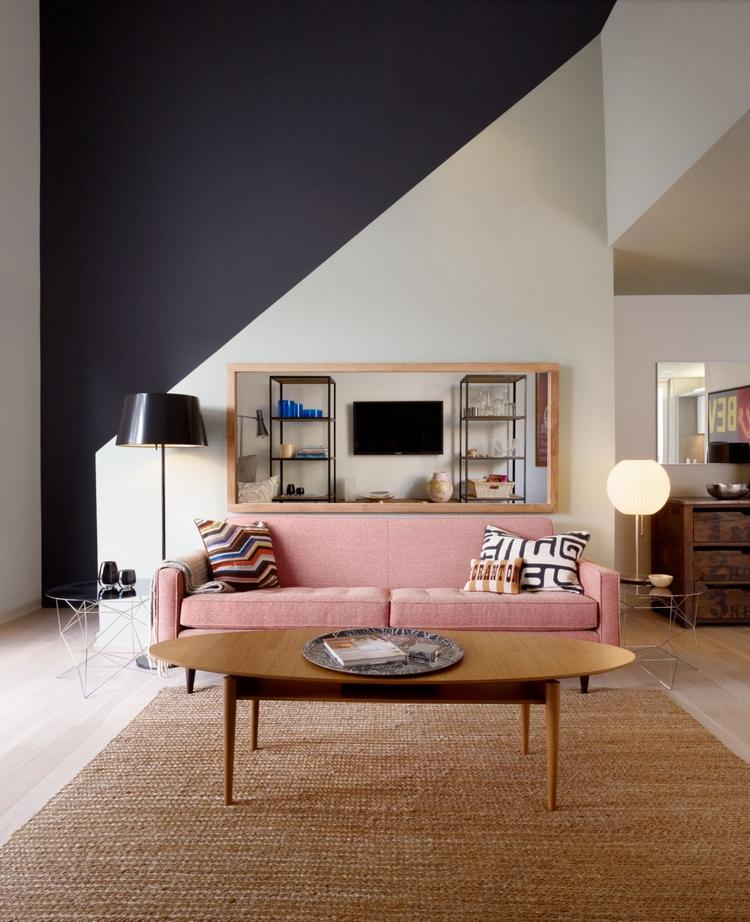 minimalistisk design i vardagsrummet med retro soffbord och geometriska väggmönster