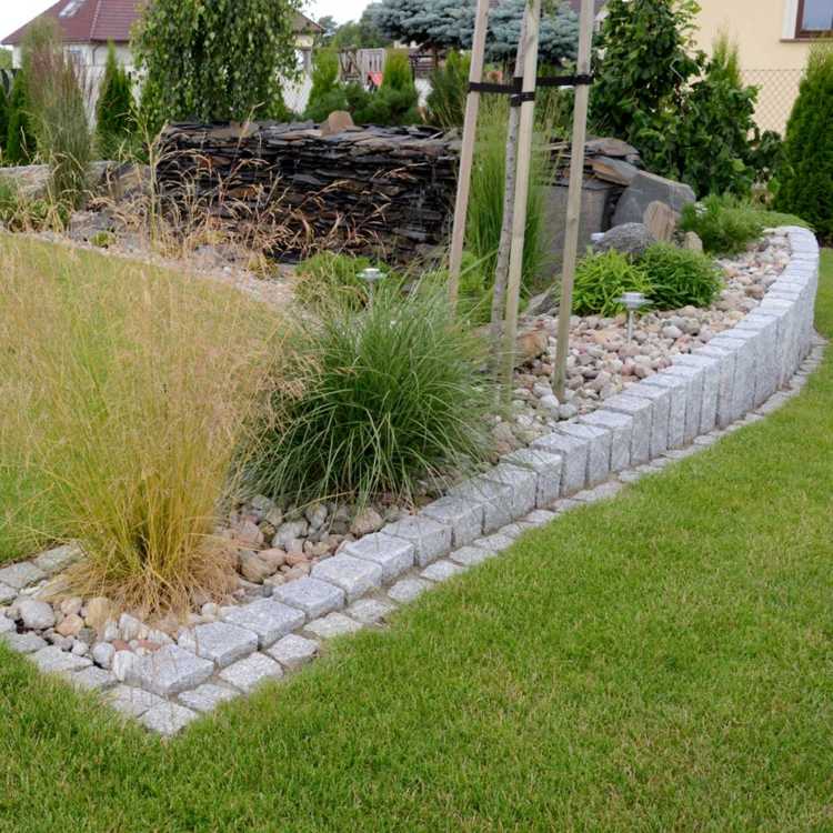 granit-palissad-trädgård design-stenar-grönt-gräs