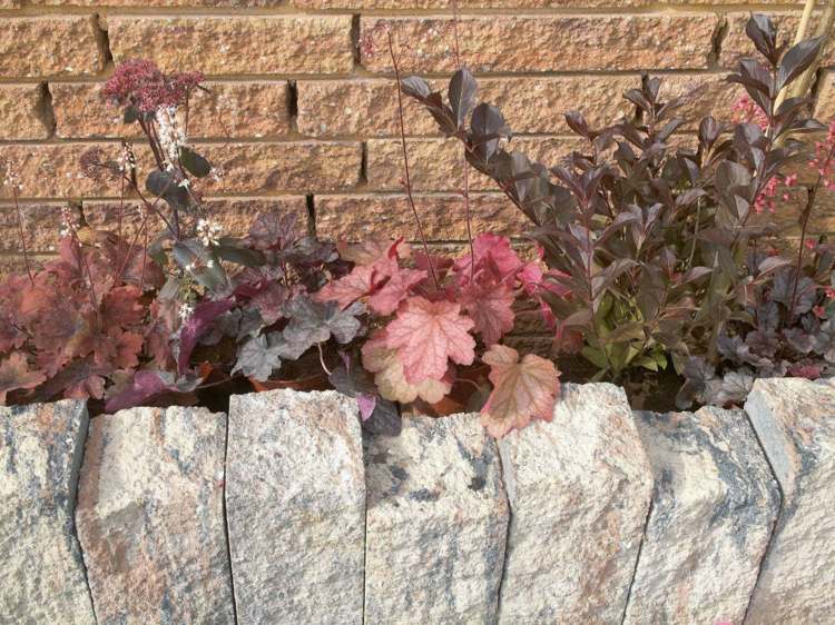 granit palissad tegel vägg trädgård design blommor