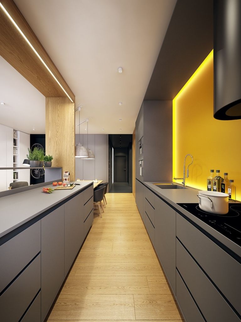 Grått kök och gul väggfärg som accenter sätter idéer för stänkskydd med belysning