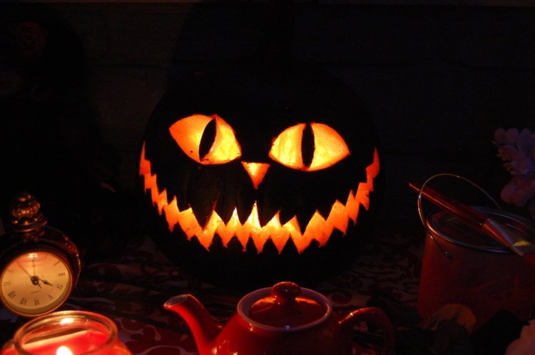 Jack-o-Lantern Halloween Cheshire Cat stora ögon skarpa tänder