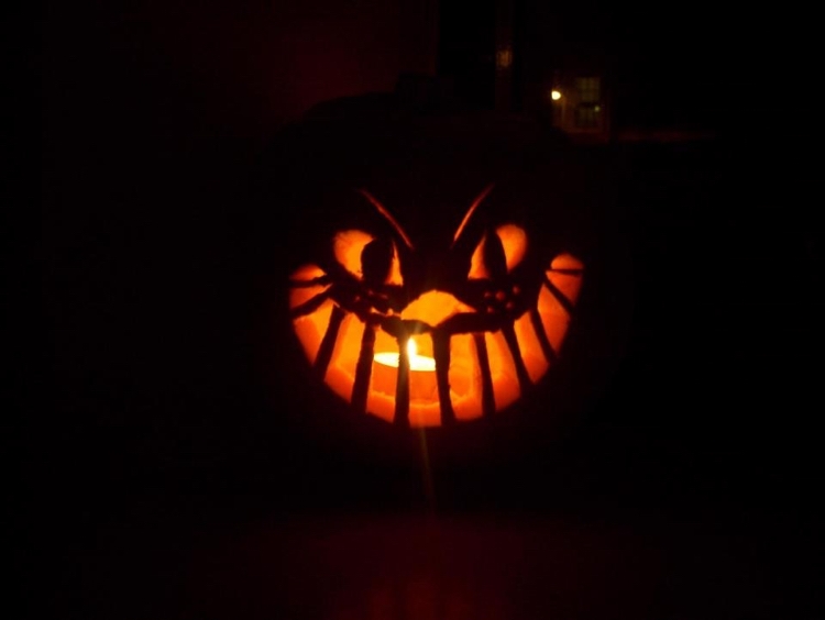Jack-o-lantern Halloween te ljus Cheshire katt ansikte