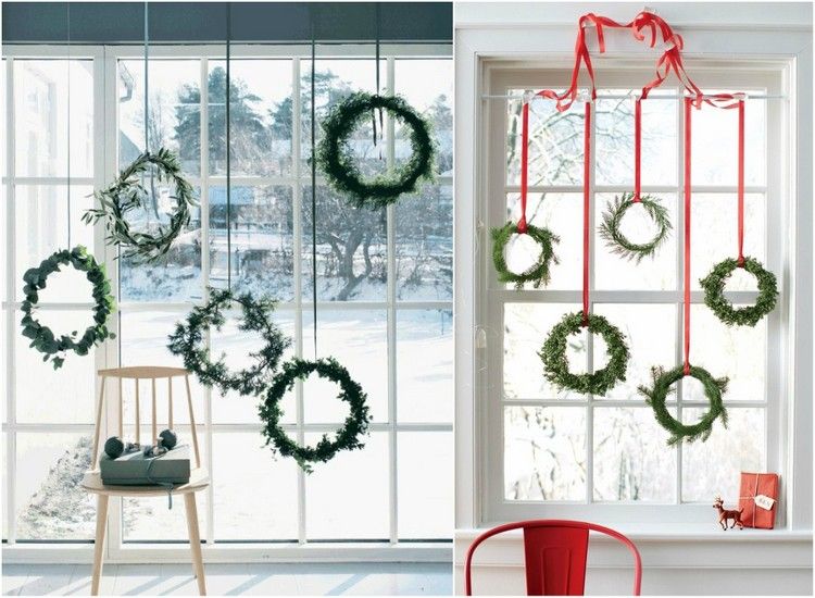 Fönster från golv till tak för juldekorationer av hängande kransar