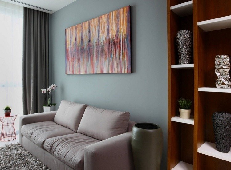 Inred ditt arbetsrum med en soffa och dekorera det bekvämt